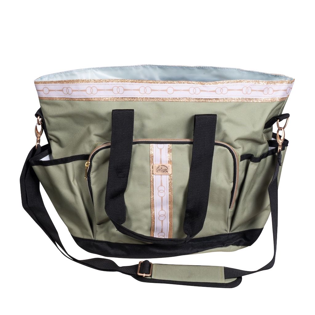 light green Grooming bag with black handles and white and gold trim in a bit pattern