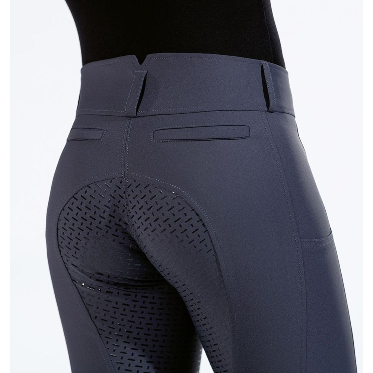Close up of back of navy breeches with grip seat and pockets.