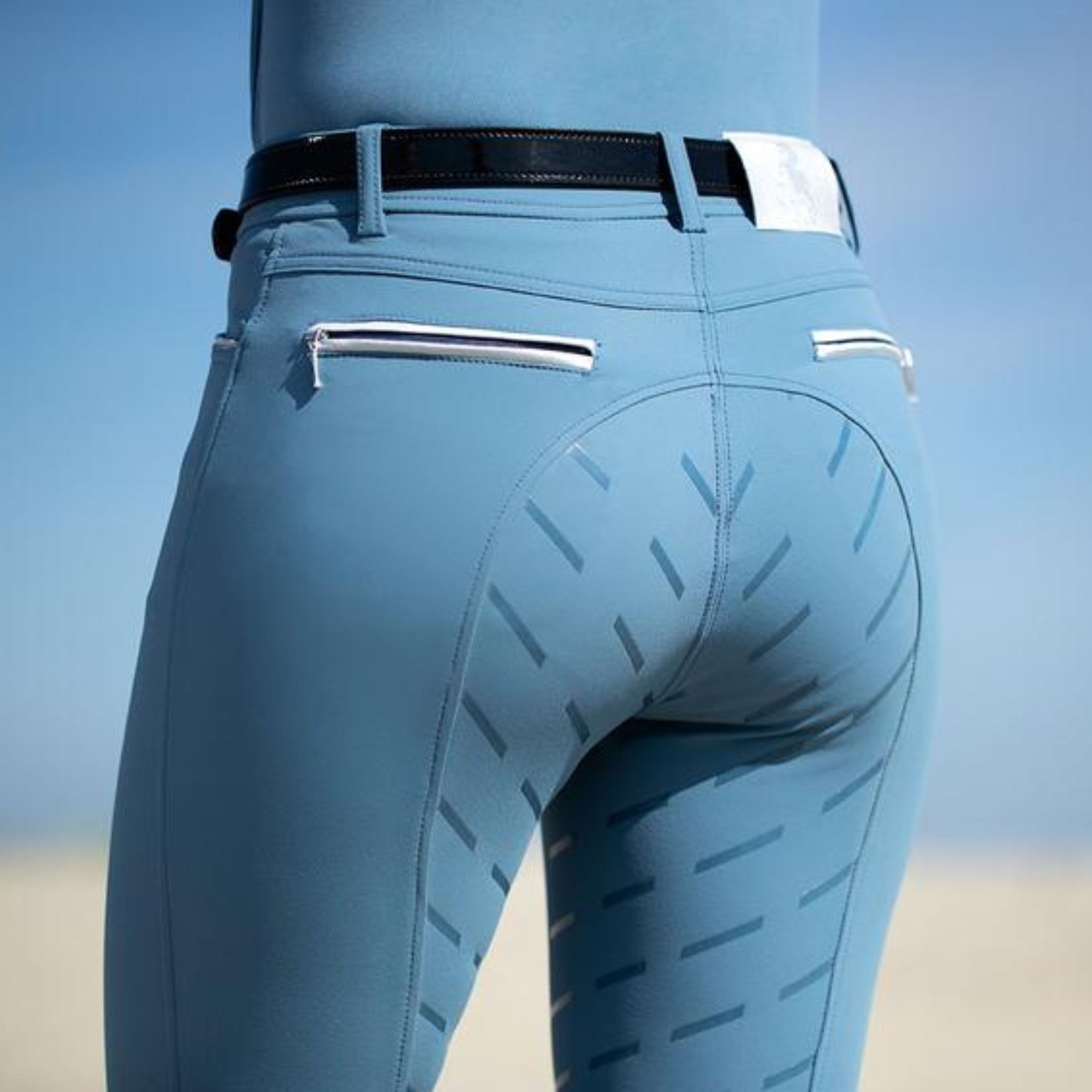 Smokey blue breeches with silicone stripped seat and white back zippers.
