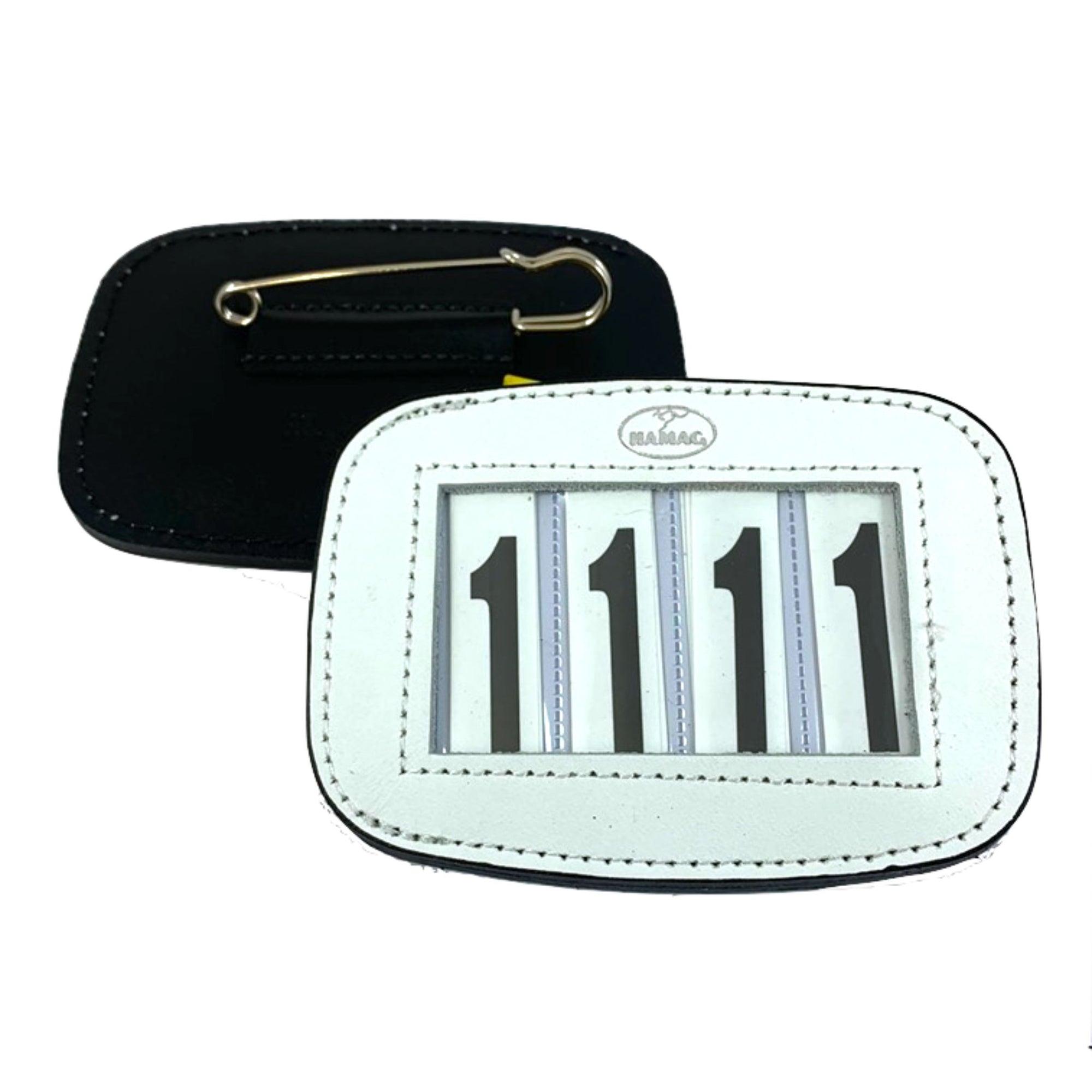 White number holder with a brass pin on back to pin on a saddle pad