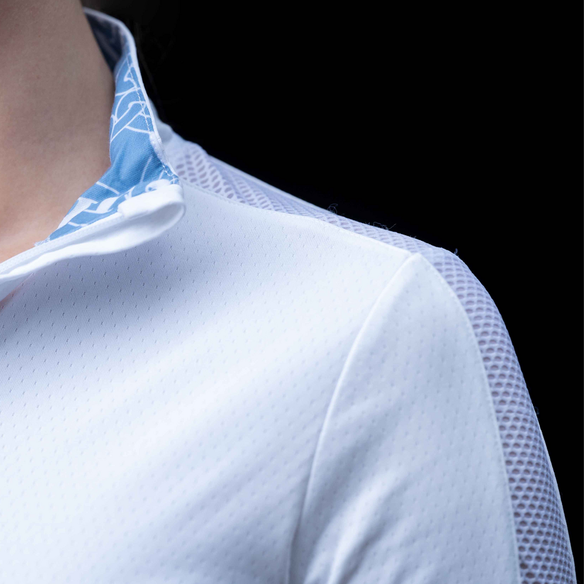 shoulder and collar of hunter shirt, showing mesh and contrast pattern.