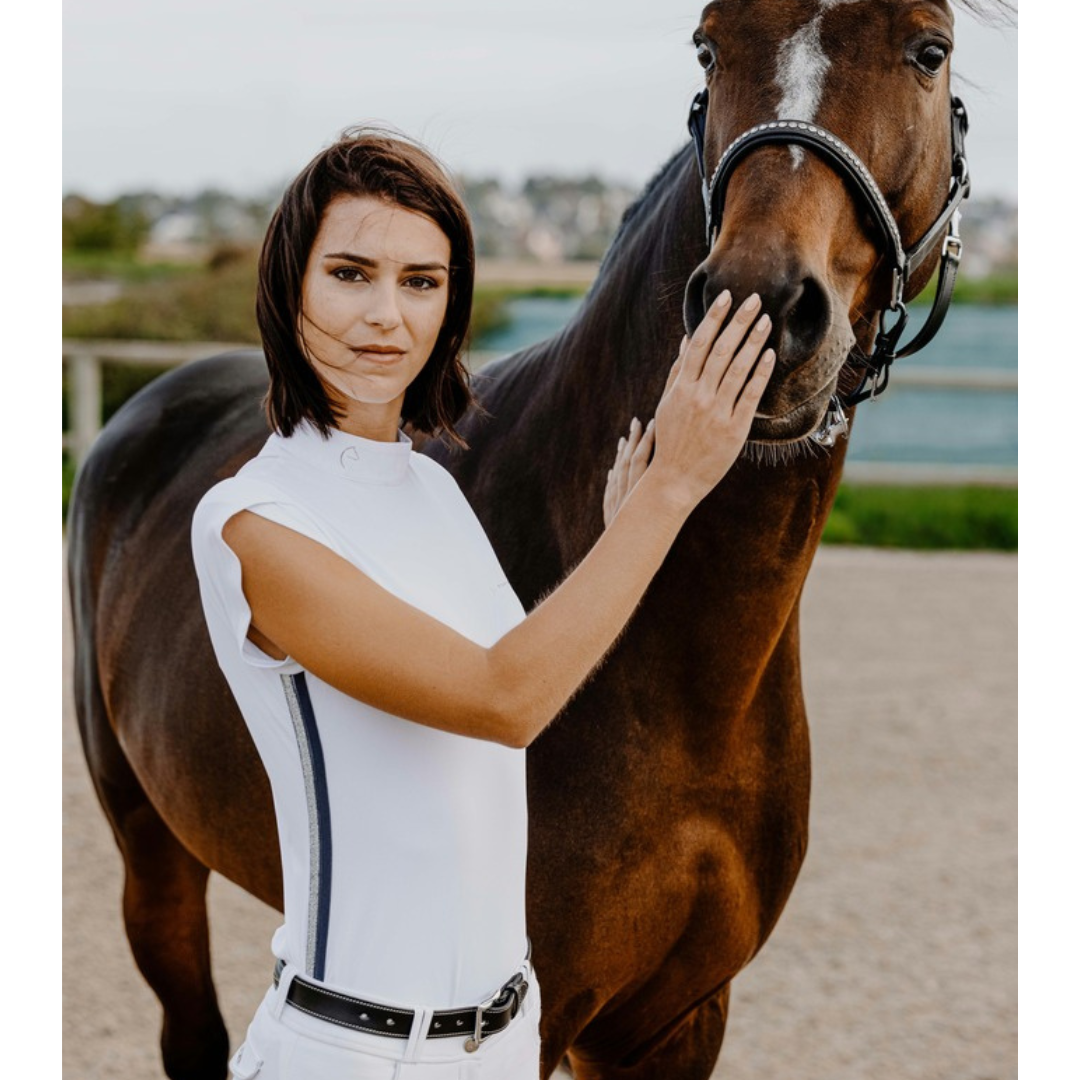white horse riding top with tulip sleeves and stripes down the side seam.