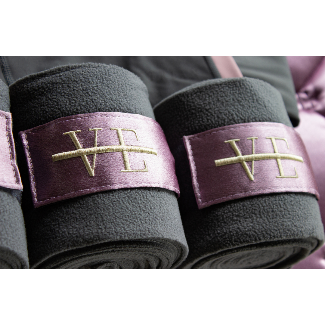 polo wrap bandages in light purple and gold on grey fleece