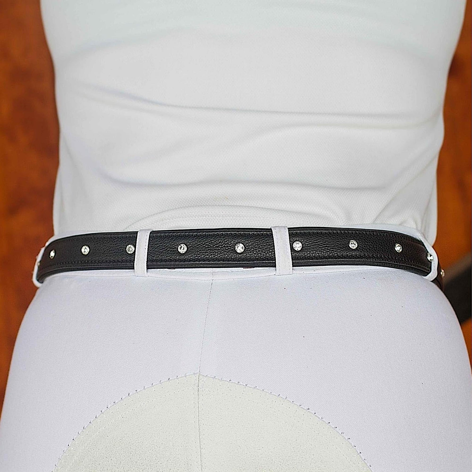 Black leather belt with an evenly distributed line of round crystals.
