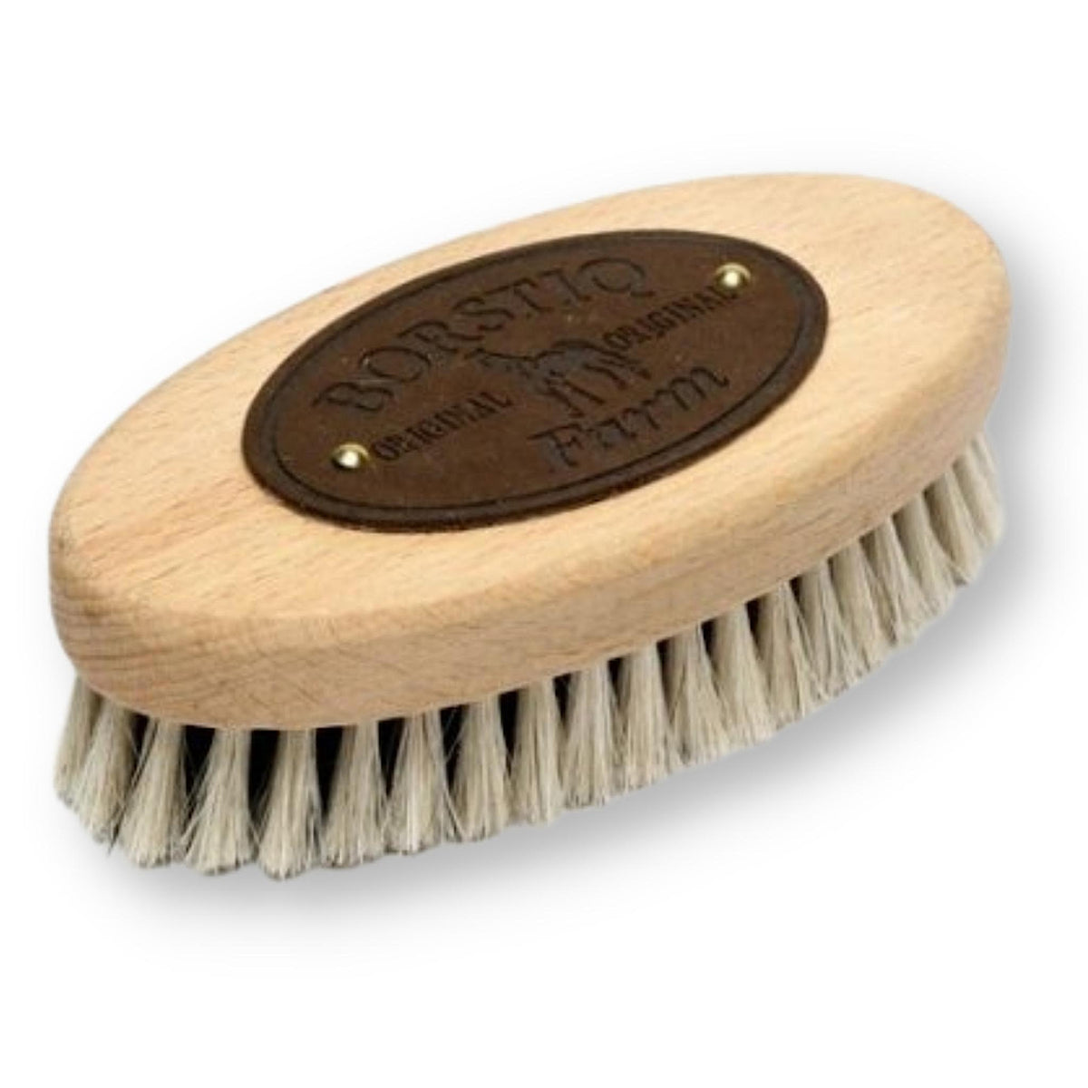 Small oval shaped brush with wooden handle and leather logo.