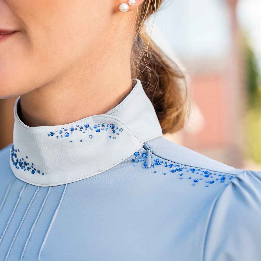 Close up of the darya competition shirt&#39;s zipper on shoulder.