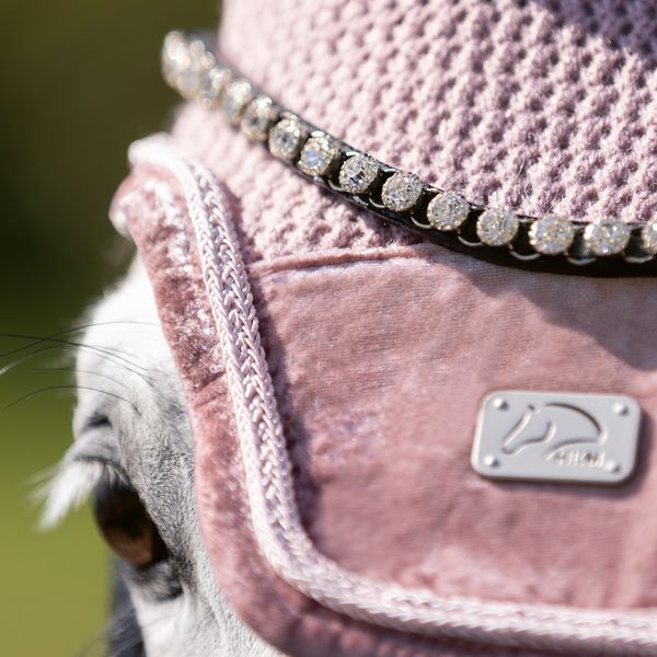 Close up of browband and blush velvet ear bonnet.