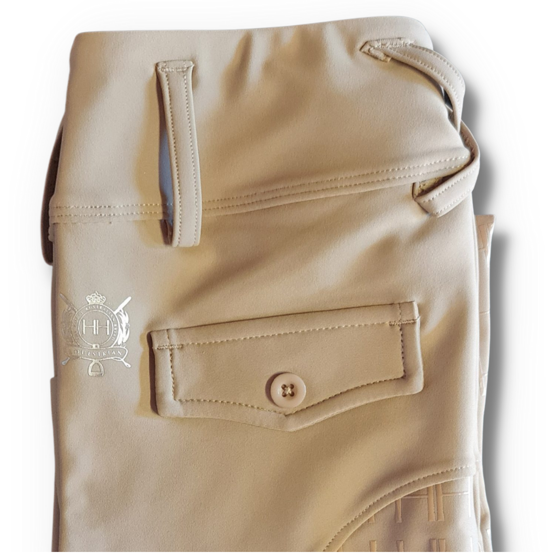 Beige riding tights with belt loops, small logo, and grip seat.