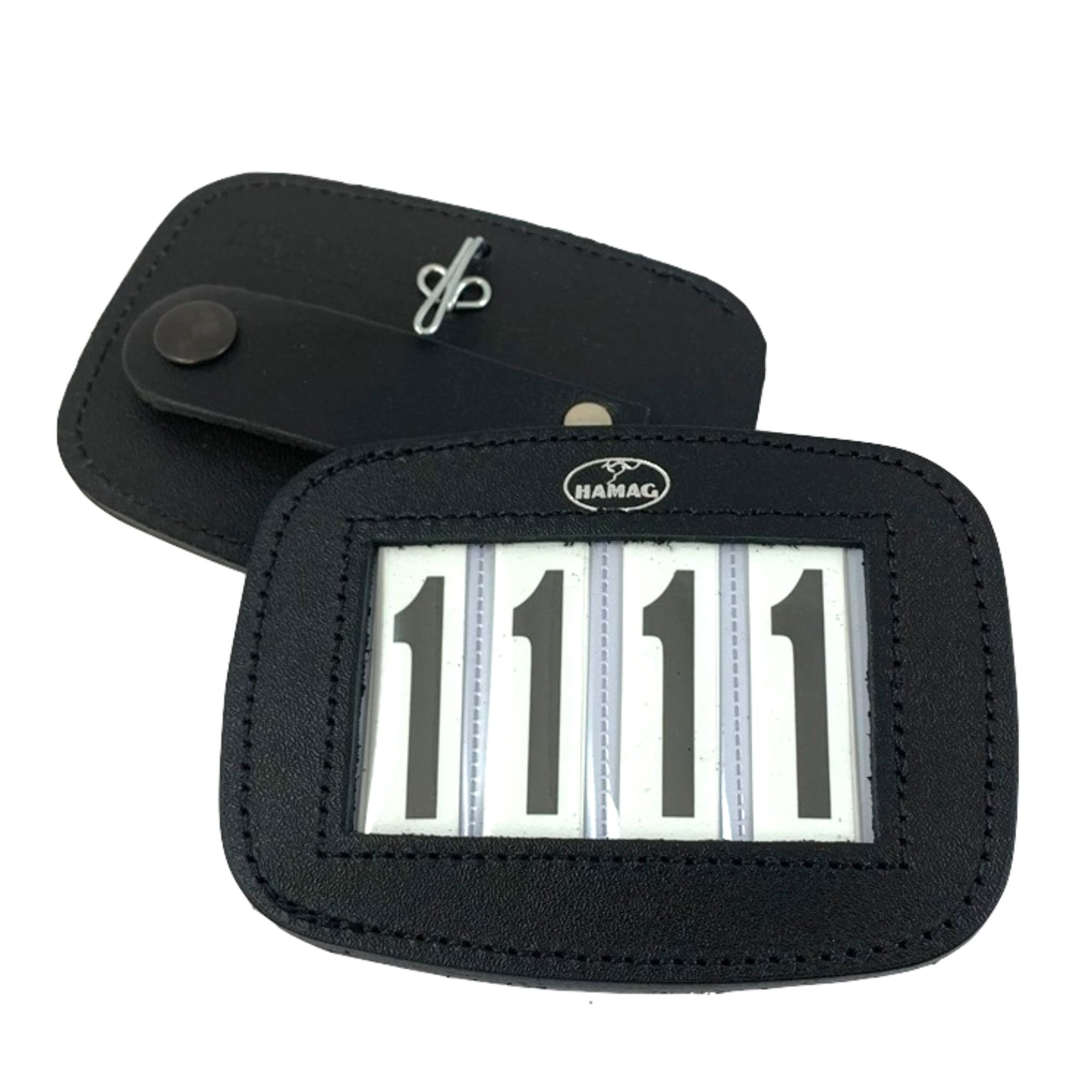 Black leather number holder with tiny Hamag logo above the slots for numbers.