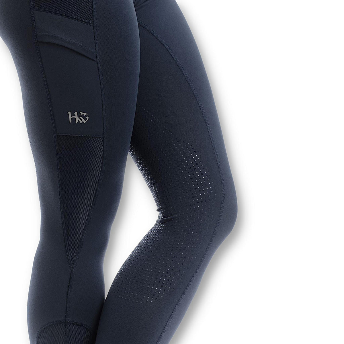 Close up of navy riding tights with silicone grip on inner leg.