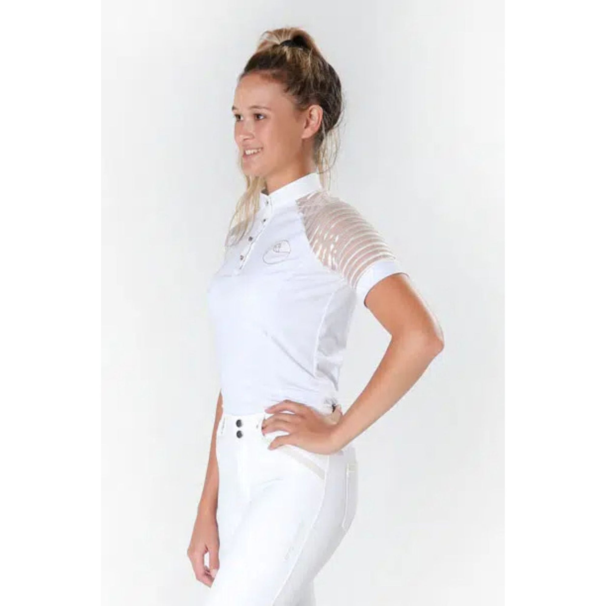 Lady wearing white show shirt with lace sleeves, white collar and cuffs.