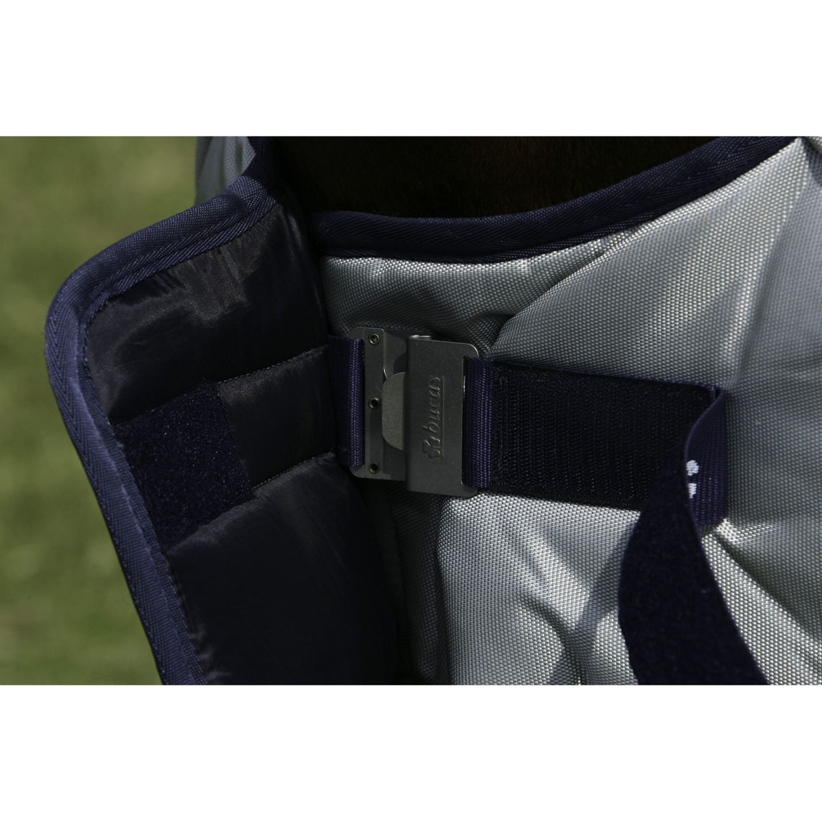 Close up of Bucas &quot;clickgo&quot; front fastener, closed, with navy strap.