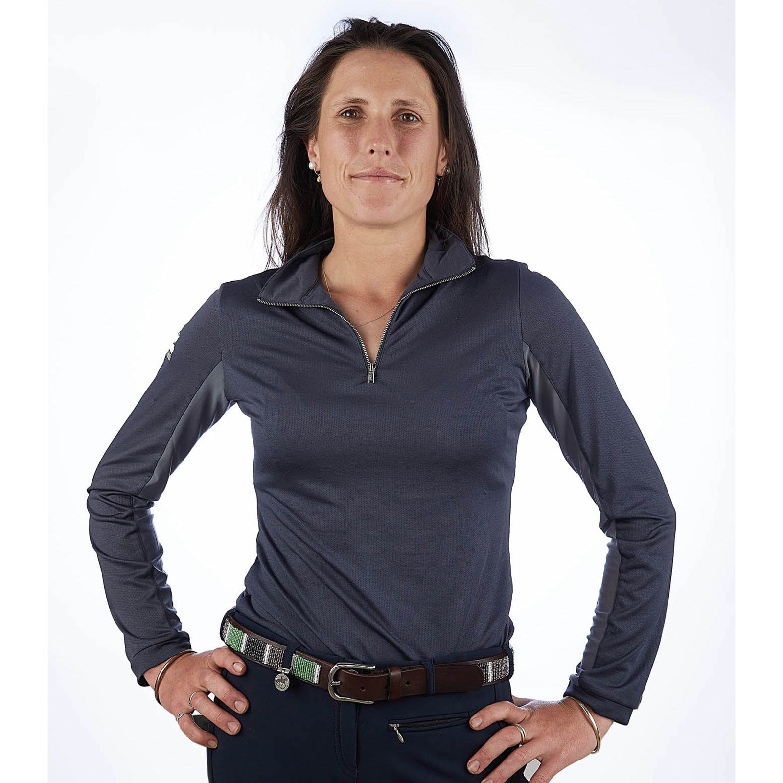 Grey top with mesh under arms and silver zip on a lady