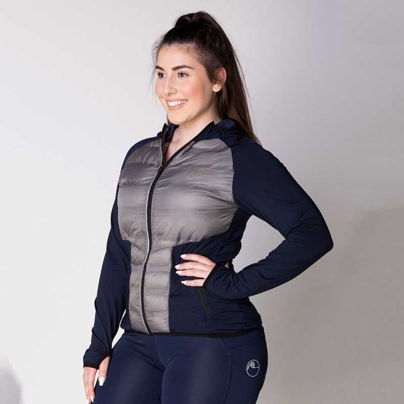 Blue jacket with black panelling and hood. 