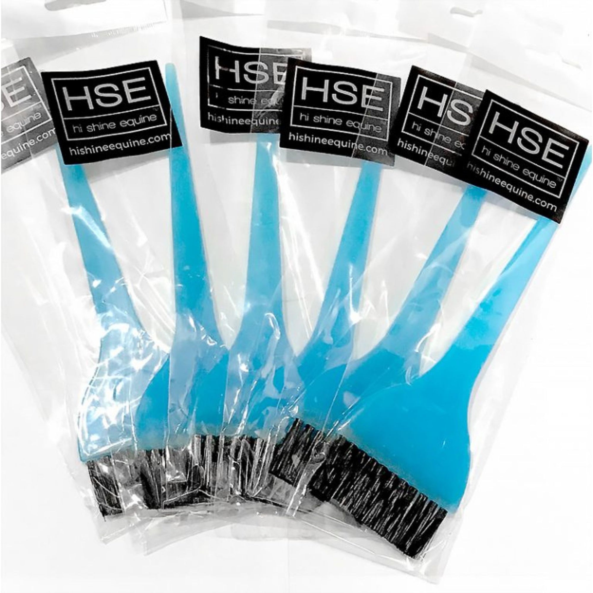 Blue hairdresser brush with black bristles in a clear plastic bag with  HSE sticker