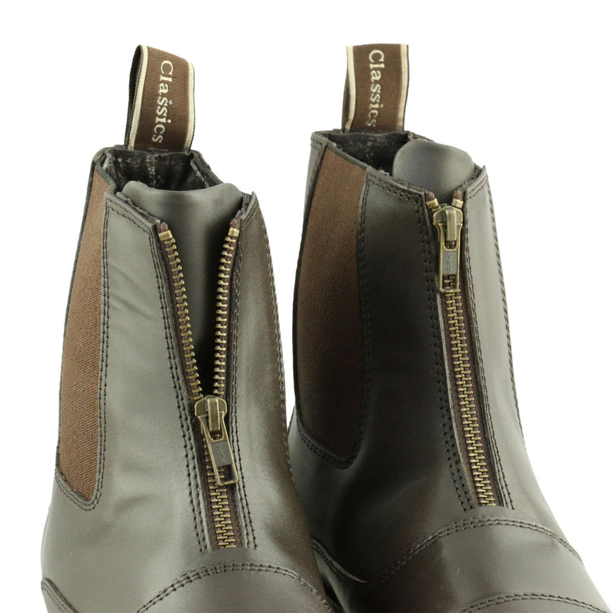 Front view of brown zip front boots with detailing across toe.